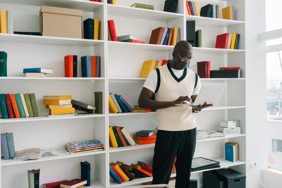 Student reading a book in the library